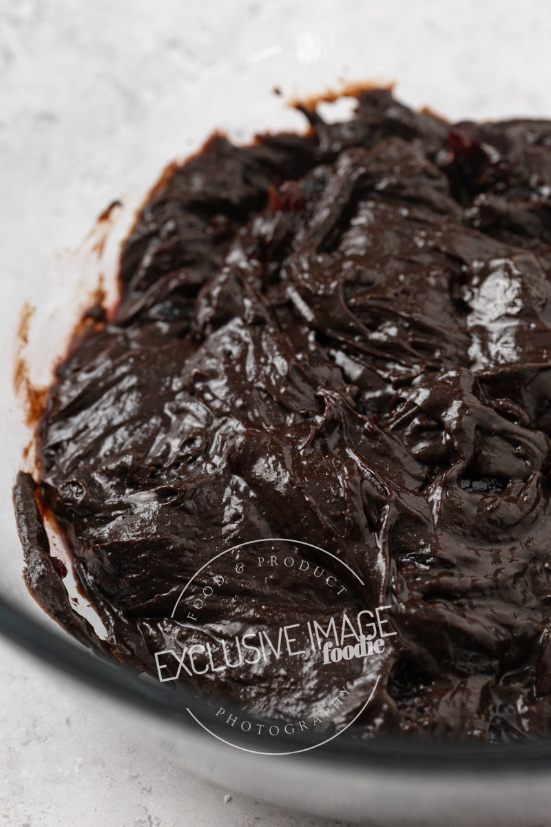 Glossy brownie batter in a bowl
