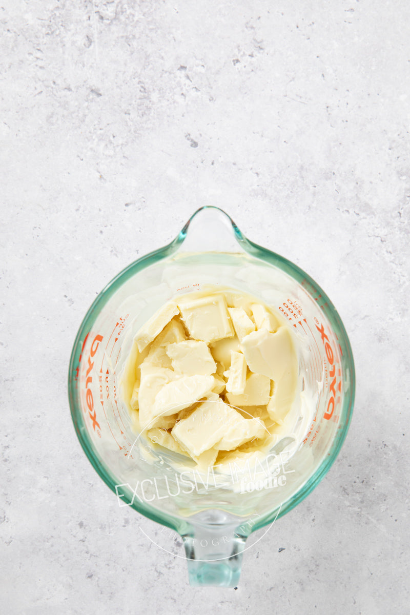 White chocolate in a glass container for melting