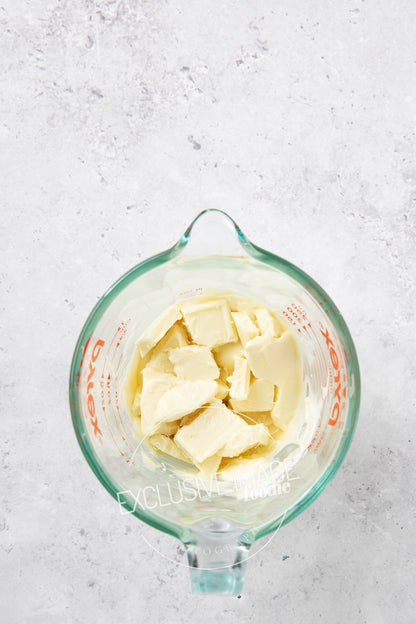 White chocolate in a glass container for melting