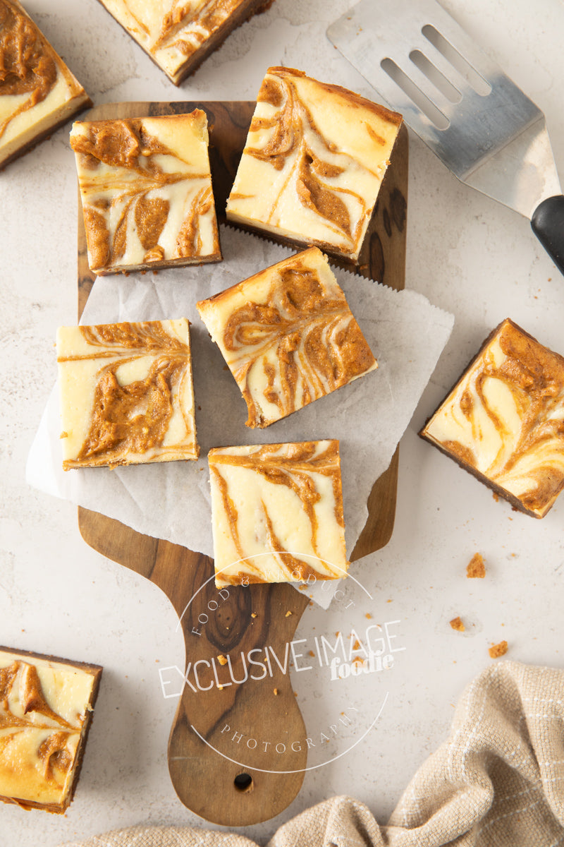Pumpkin cheesecake bars recipe flat lay hero exclusive recipe photography
