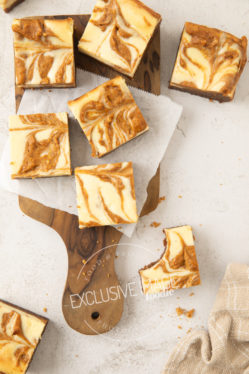Pumpkin cheesecake bars recipe flat lay hero exclusive recipe photography
